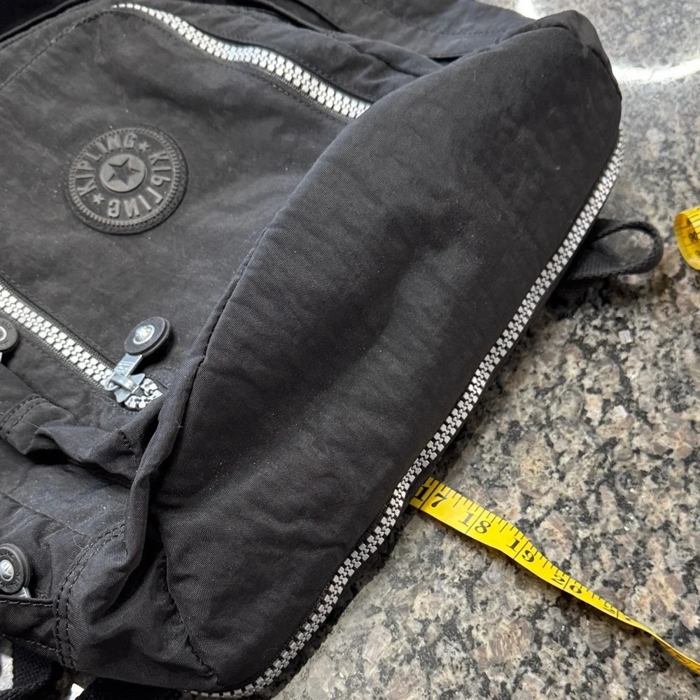 Kipling Hal Expandable Black Backpack with large Silver Accent zippers EUC